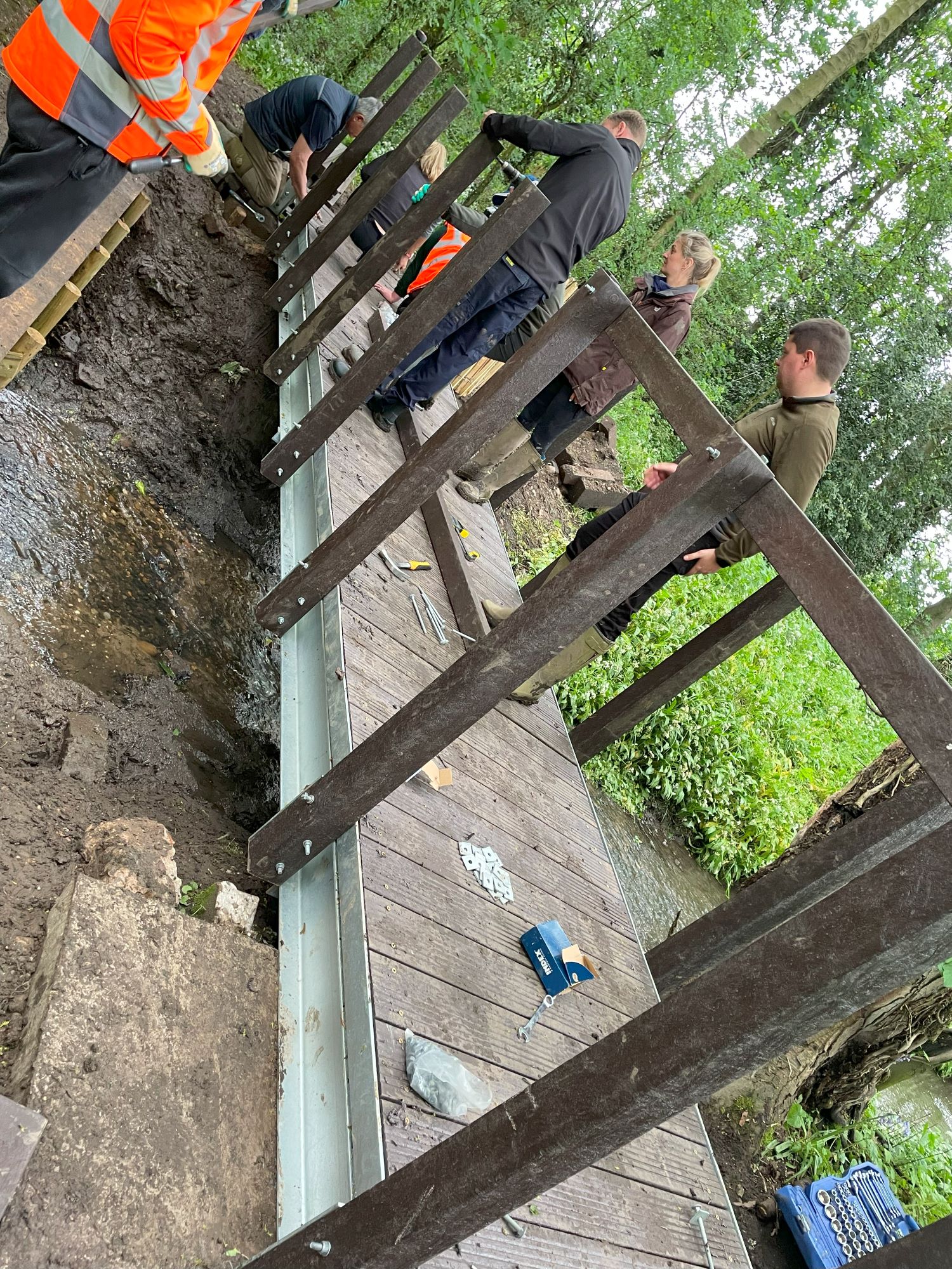 Prologis staff working on a bridge