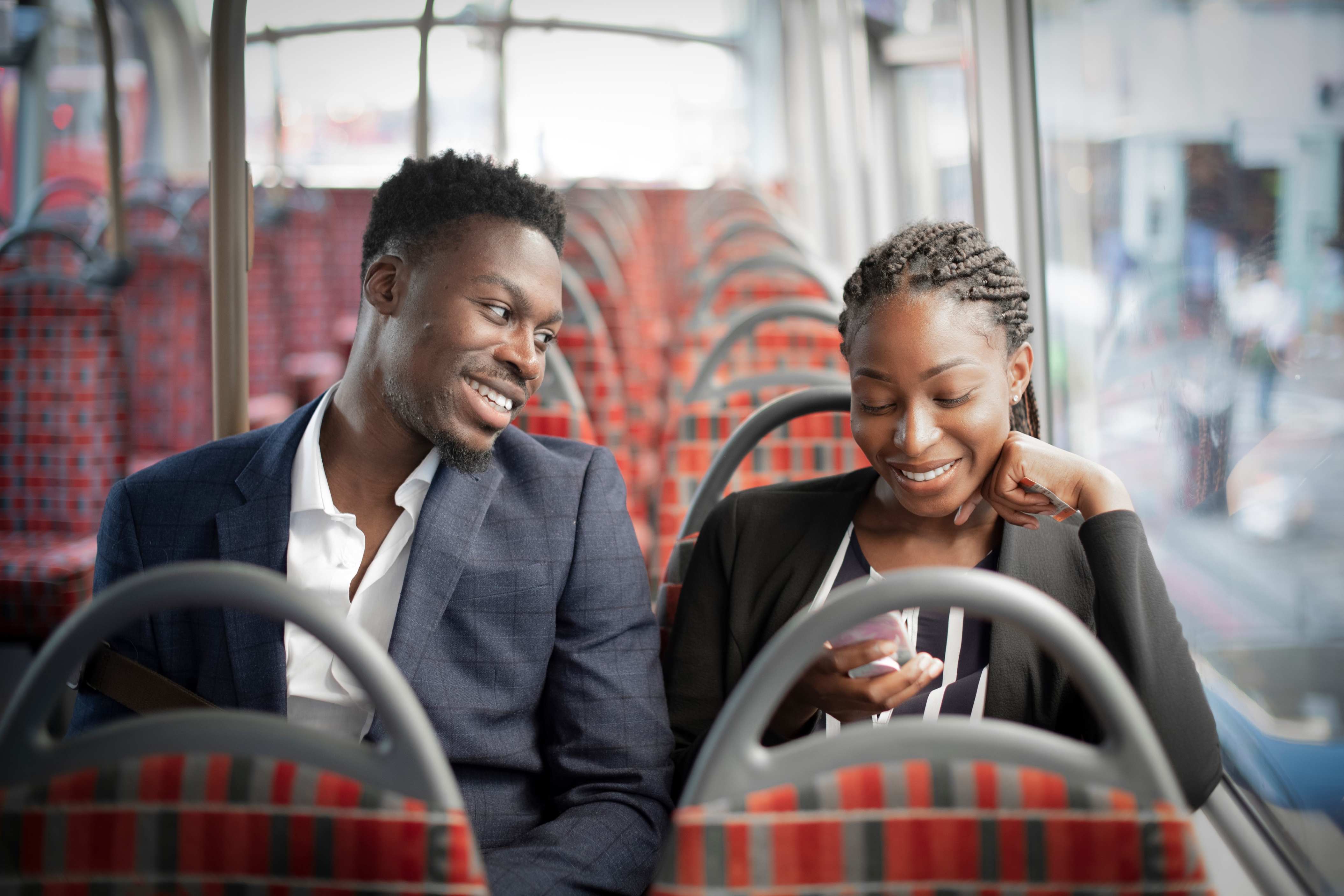 Two people on a public bus