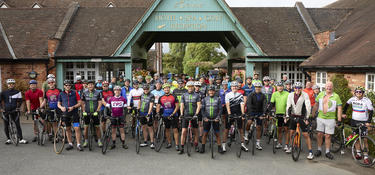 group photo of riders in the Prologis 100 cycle event